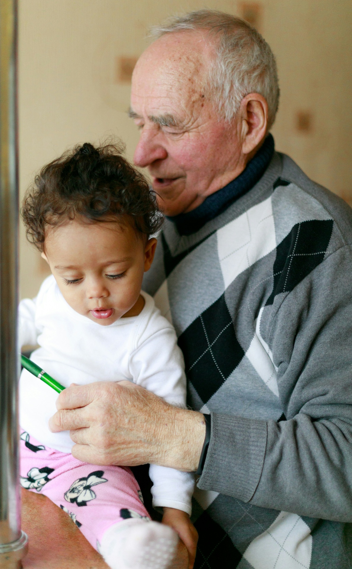 Grandfather holding his young granddaughter